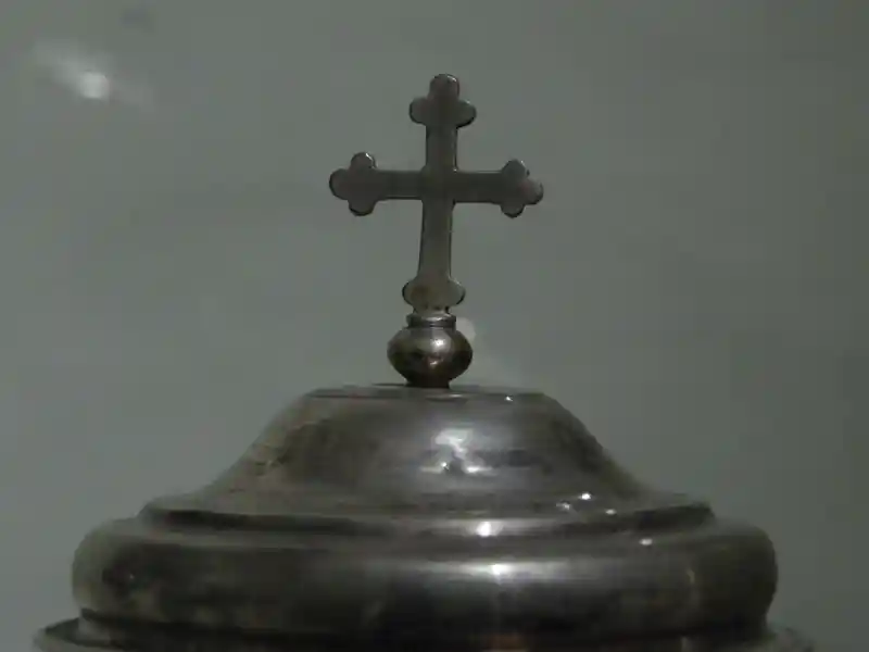 Metal budded cross on top of a sphere, Cathedral Museum and The Labyrinth of Porsenna